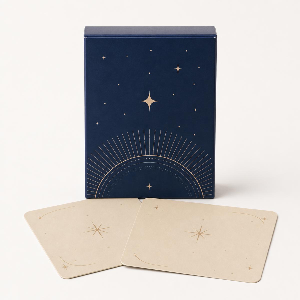 Indigo keepsake box with two sand-colored cards on a clean studio background